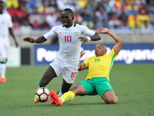Sadio Mane tackled by Andile Jali