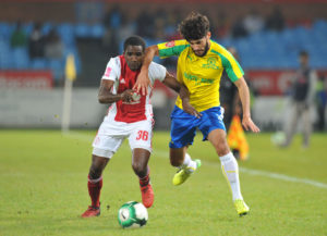 Fares Hachi challenged by Aubrey Funga
