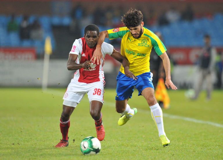 Fares Hachi challenged by Aubrey Funga