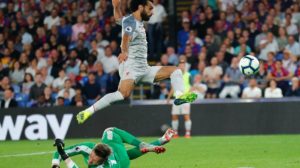 Mohamed Salah of Liverpool and Wayne Hennessy of Crystal Palace.