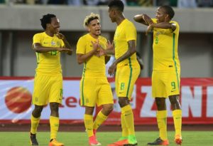 Percy Tau of Bafana Bafana with teammates Keagan Dolly, Bongani Zungu