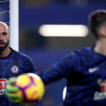 Chelsea goalkeeper Willy Caballero looks on at goalkeeper Kepa Arrizabalaga during the warm up before the Premier League match at Stamford Bridge, London.