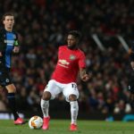 Club Brugge's Percy Tau chases down Manchester United midfielder Fred