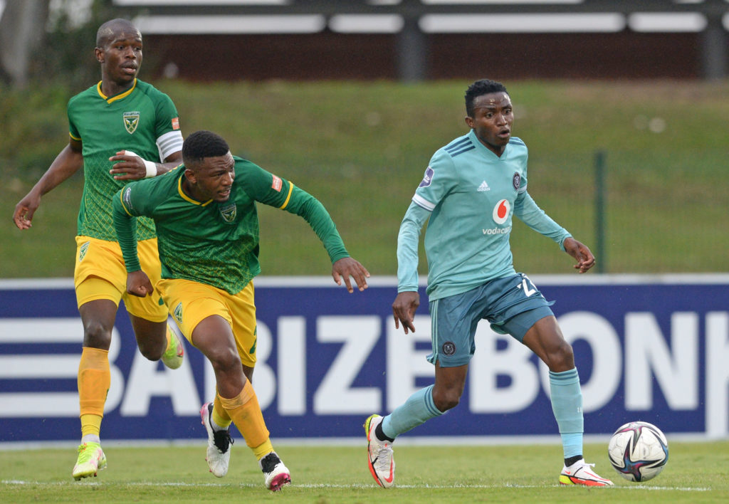 Neverdie Makhubela of Orlando Pirates is challenged by Nqobeko Dlamini of Golden Arrows