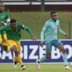 Neverdie Makhubela of Orlando Pirates is challenged by Nqobeko Dlamini of Golden Arrows