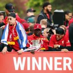 LIVERPOOL, ENGLAND - MAY 29: Sadio Mane of Liverpool holds the Carabao Cup Trophy alongside teammates during the Liverpool Trophy Parade on May 29, 2022 in Liverpool, England. (Photo by Jan Kruger/Getty Images)