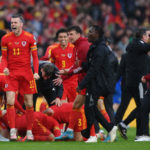 Gareth Bale of Wales celebrates with teammates after their sides victory, which qualifies Wales for the 2022 FIFA World Cup during the FIFA World Cup Qualifier between Wales and Ukraine at Cardiff City Stadium on June 05, 2022 in Cardiff, Wales. (Photo by Shaun Botterill/Getty Images)