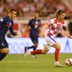 Luka Modric of Croatia runs with the ball whilst under pressure from Antoine Griezmann of France during the UEFA Nations League League A Group 1 match between Croatia and France at Stadion Poljud on June 06, 2022 in Split, Croatia. (Photo by Jurij Kodrun/Getty Images)