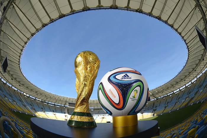 RIO DE JANEIRO, BRAZIL - DECEMBER 03: A general view of Brazuca and the FIFA World Cup Trophy at the Maracana before the adidas Brazuca launch at Parque Lage on December 3, 2013 in Rio de Janeiro, Brazil. Brazuca is the Official Match Ball for the FIFA World Cup 2014 Brazil. Tonight adidas revealed brazuca to the world in the stunning setting of Parque Lage in Rio de Janeiro. The reveal was part of a spectacular light projection supported by global footballers Seedorf, Hernane and FIFA World Cup Winner Cafu. Hundreds of guests and celebrities were treated to this one off experience, which launched the Official FIFA World Cup Ball for Brazil 2014. For more information visit: news.adidas.com/worldcupOMB (Photo by Alexandre Loureiro/Getty Images for adidas)