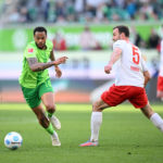 WOLFSBURG, GERMANY - MARCH 29: Lukas Nmecha of VfL Wolfsburg battles for possession with Benedikt Gimber of 1.FC Heidenheim 1846 during the Bundesliga match between VfL Wolfsburg and 1. FC Heidenheim 1846 at Volkswagen Arena on March 29, 2025 in Wolfsburg, Germany. (Photo by Stuart Franklin/Getty Images)