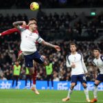 Arsenal stay top, Liverpool beat nine-man Spurs
