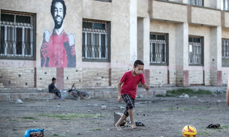 Salah admired from afar in home village as club tensions swirl