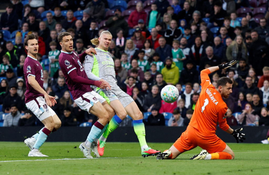 City take top spot, Burnley relegated