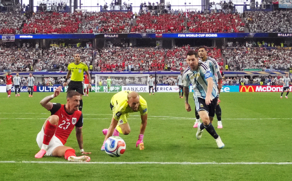 Messi’s historic brace powers Argentina into last 32