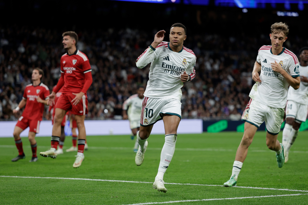 Mbappe double lifts Madrid to third
